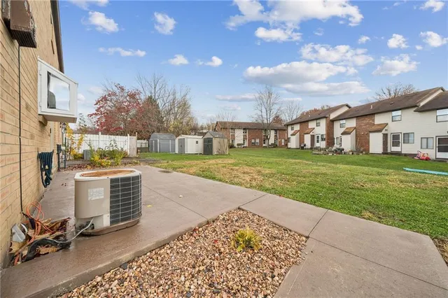 an aerial view of a houses with a yard
