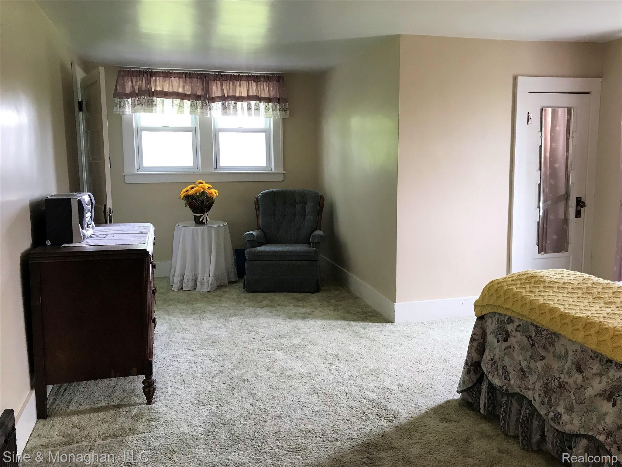 7206 Kinde Road Port Hope, MI 48468 - Photo 31 of 49 Third bedroom with hardwood floors under carpet and large closet.