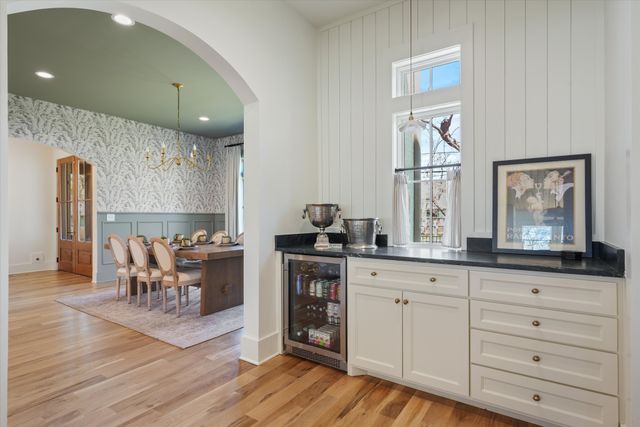 a kitchen with stainless steel appliances a sink stove and cabinets