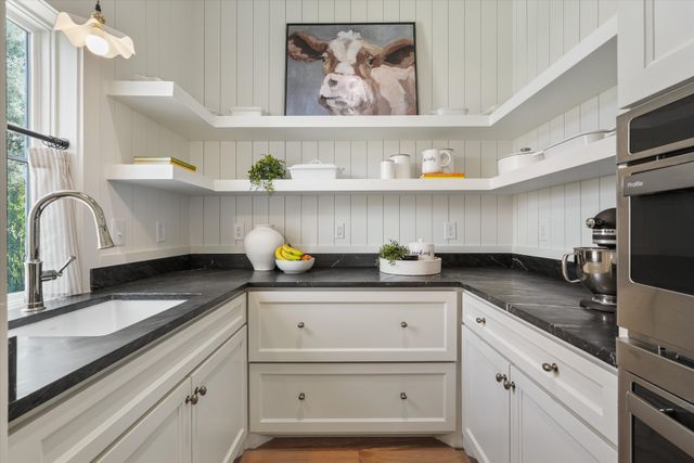 a view of a dining room with furniture wooden floor and chandelier