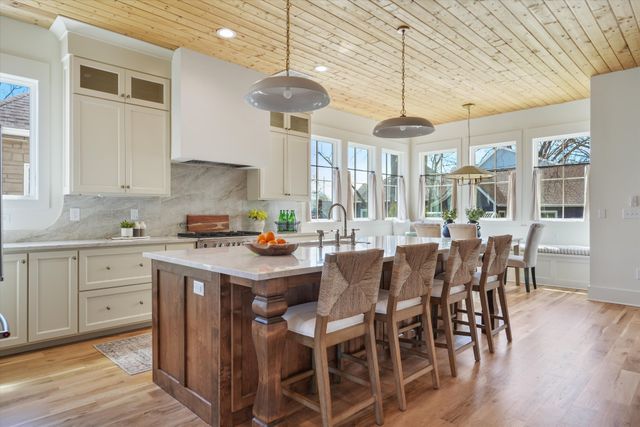 a living room with furniture and view of kitchen