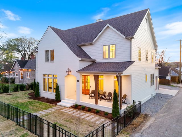 a view of a livingroom with furniture and a potted plant