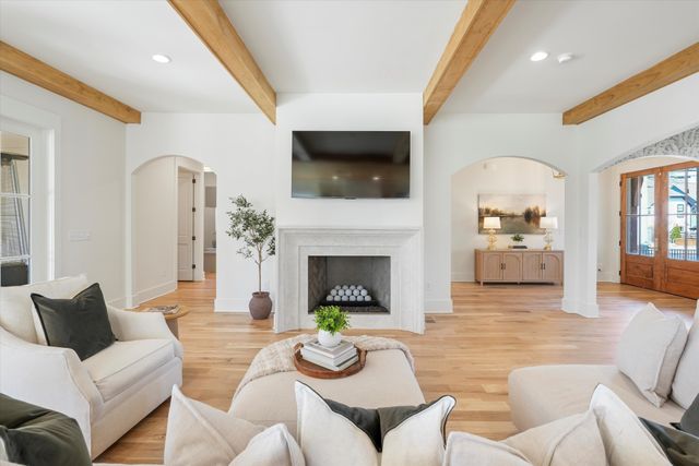 a living room with furniture and a window