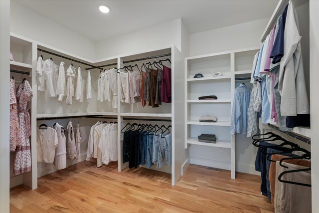 a living room with patio furniture and a potted plant