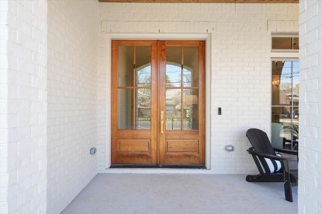 a bathroom with a double vanity sink a mirror and a bathtub