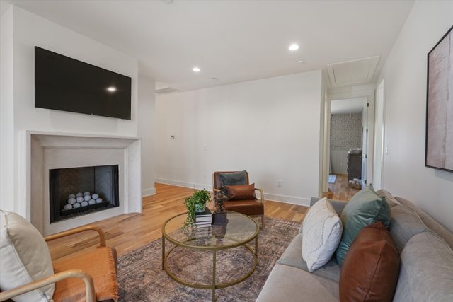 a front view of a house with a iron gate