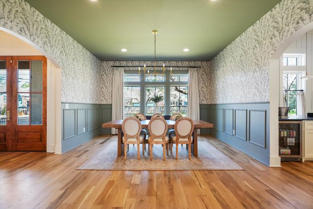 a kitchen with granite countertop a sink stainless steel appliances and cabinets