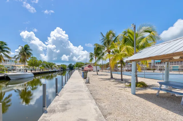 a view of a swimming pool with outdoor seating
