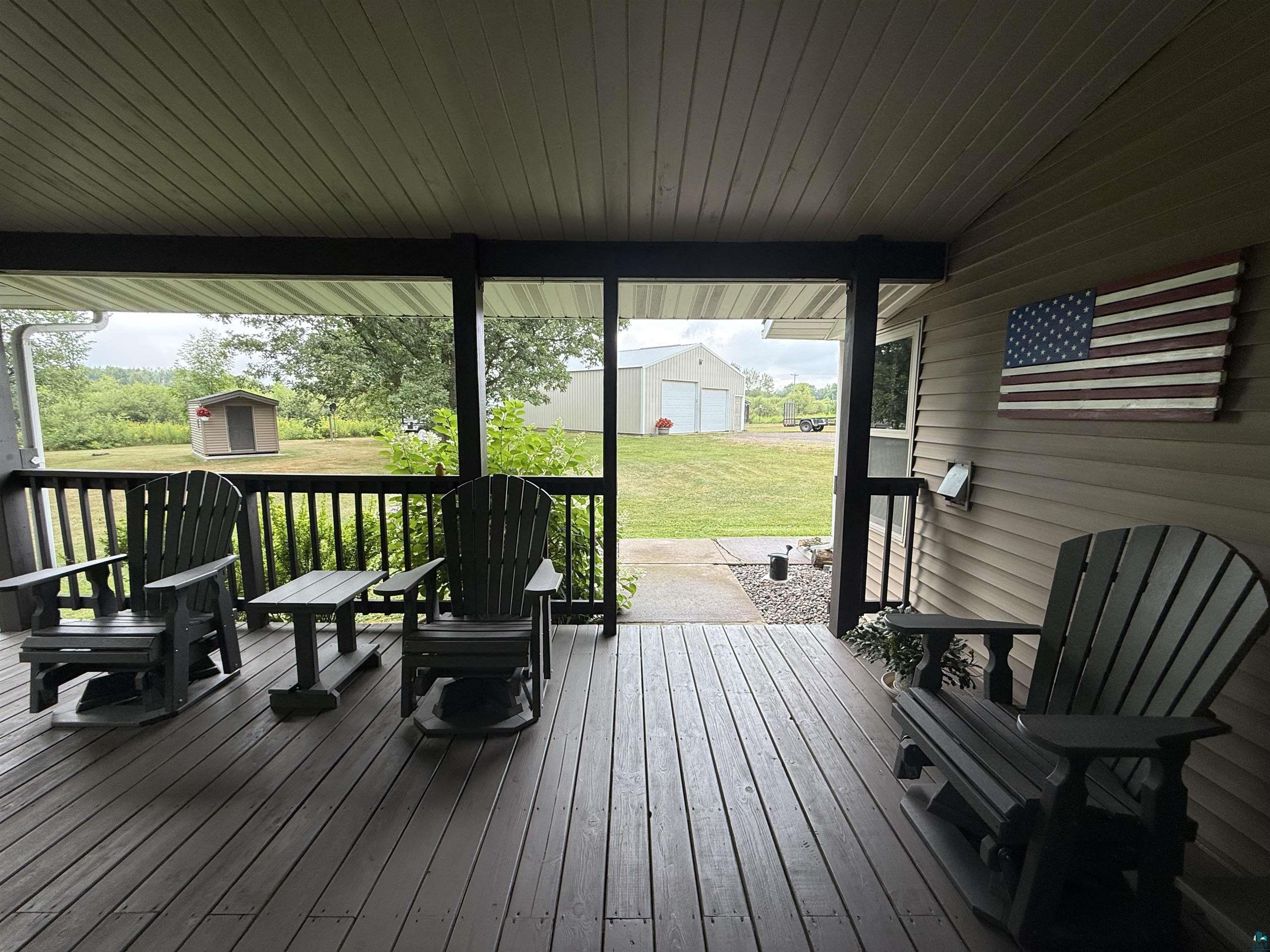 5080 Tower Road Moose Lake, MN 55767 - Photo 18 of 49 Expansive screened porch with a composite decking floor, horizontal vinyl siding, and a white soffit ceiling