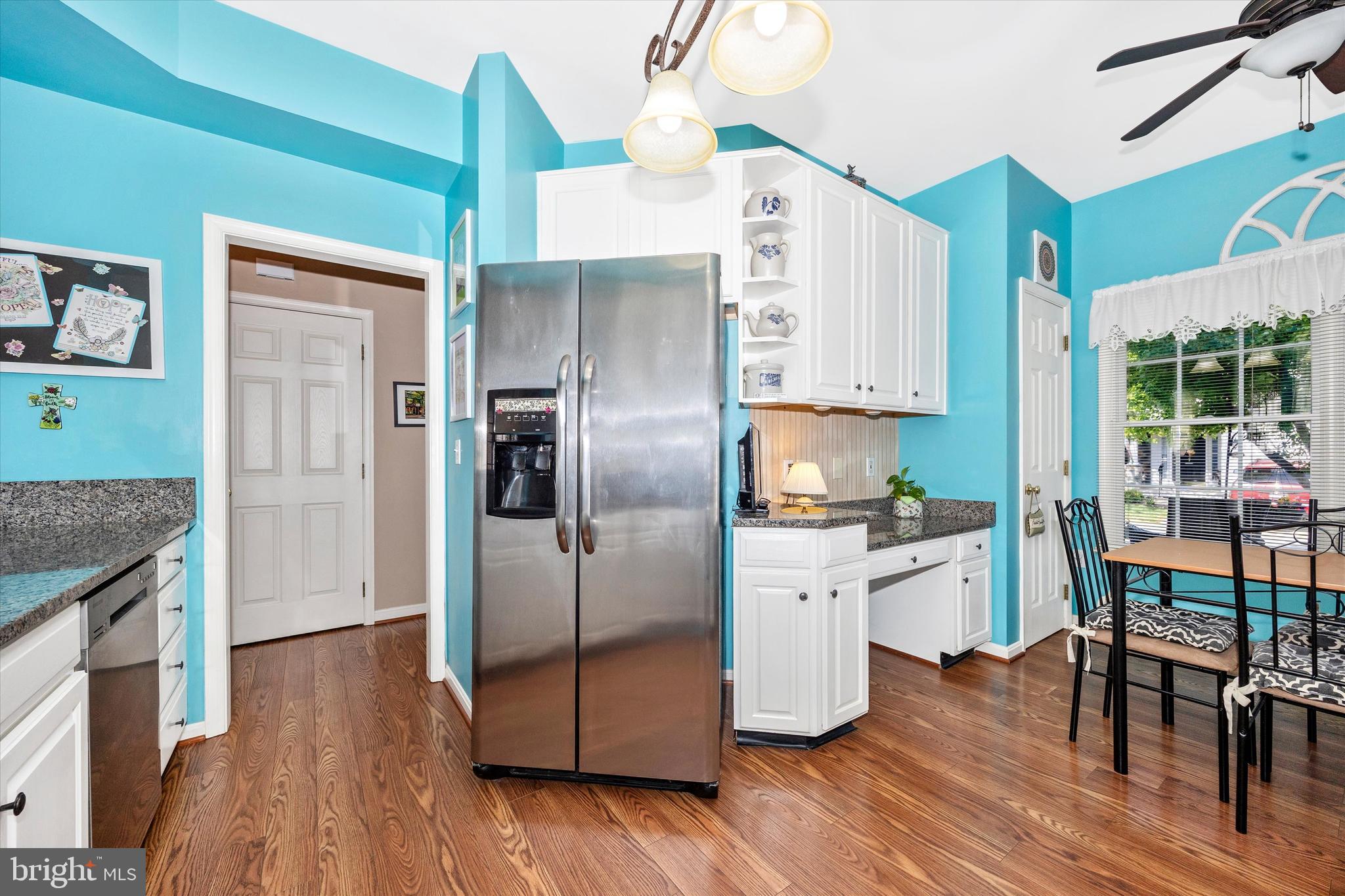 1005 Eastbourne Terrace Frederick, MD 21702 - Photo 11 of 39 a kitchen with stainless steel appliances granite countertop a refrigerator a stove and a wooden floors