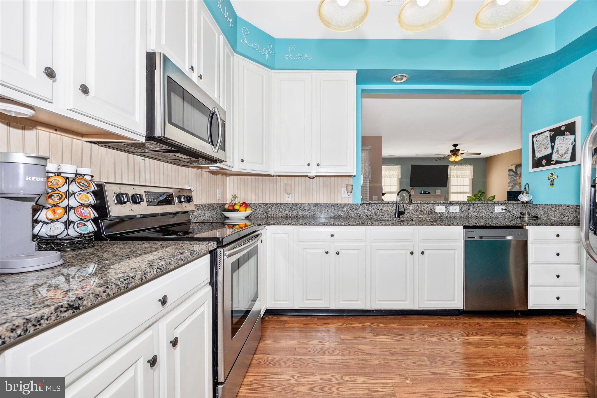 1005 Eastbourne Terrace Frederick, MD 21702 - Photo 14 of 39 a kitchen with stainless steel appliances granite countertop a sink stove and cabinets