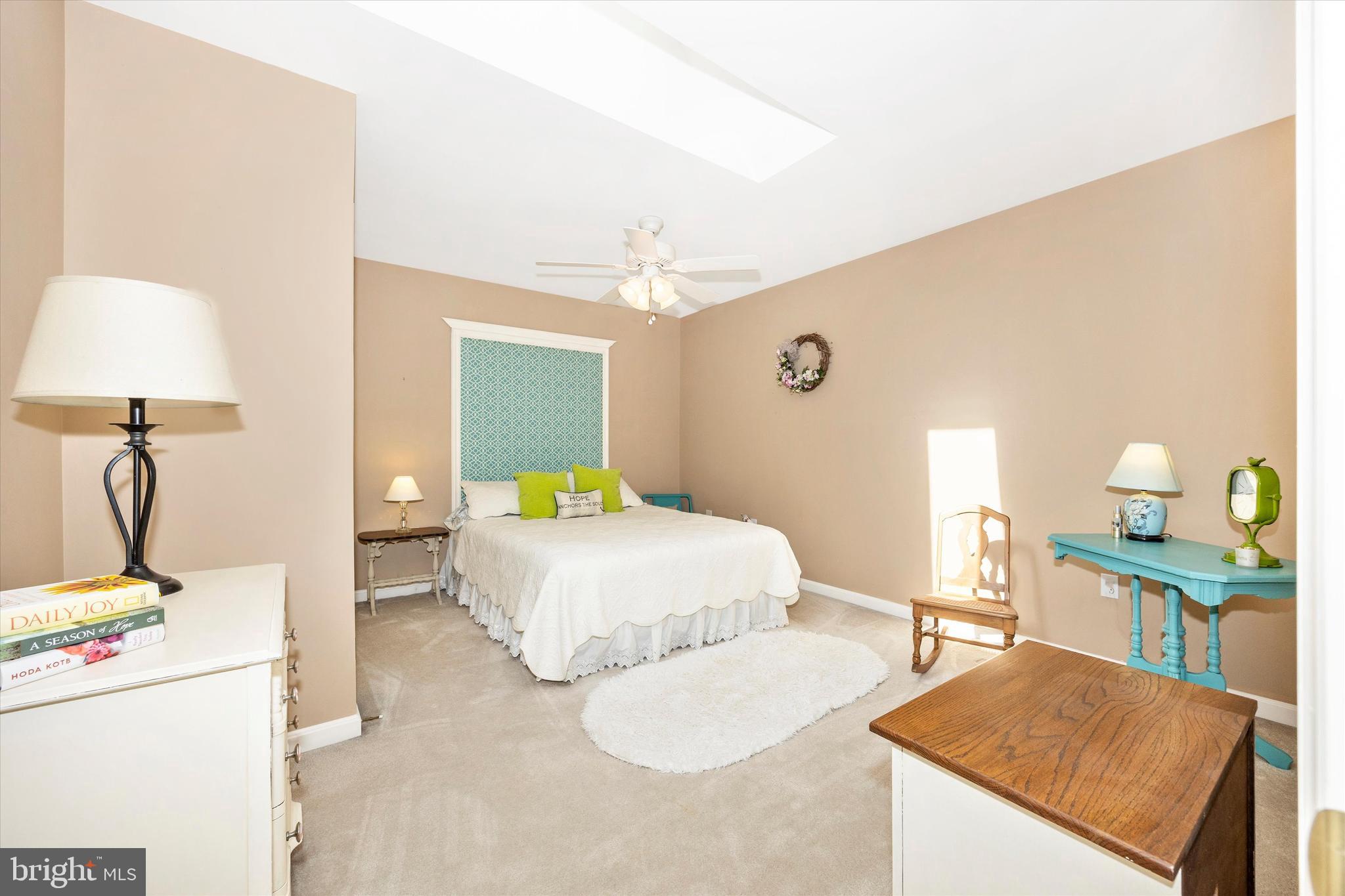 1005 Eastbourne Terrace Frederick, MD 21702 - Photo 26 of 39 a bedroom with a bed and a lamp on table