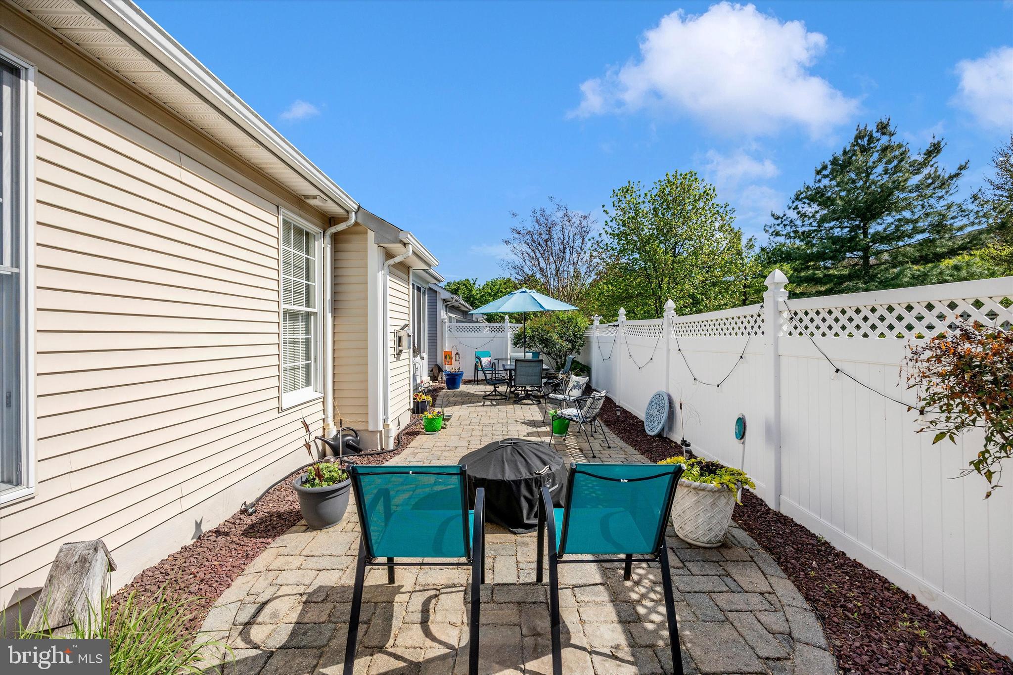 1005 Eastbourne Terrace Frederick, MD 21702 - Photo 34 of 39 a view of a patio with table and chairs with wooden floor and fence