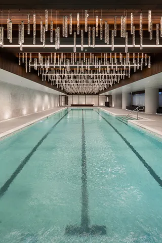 a room with a black car and a rug