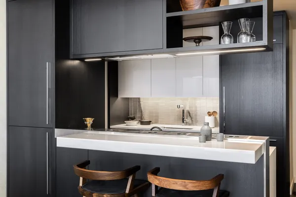 a kitchen with a stove a sink and a refrigerator