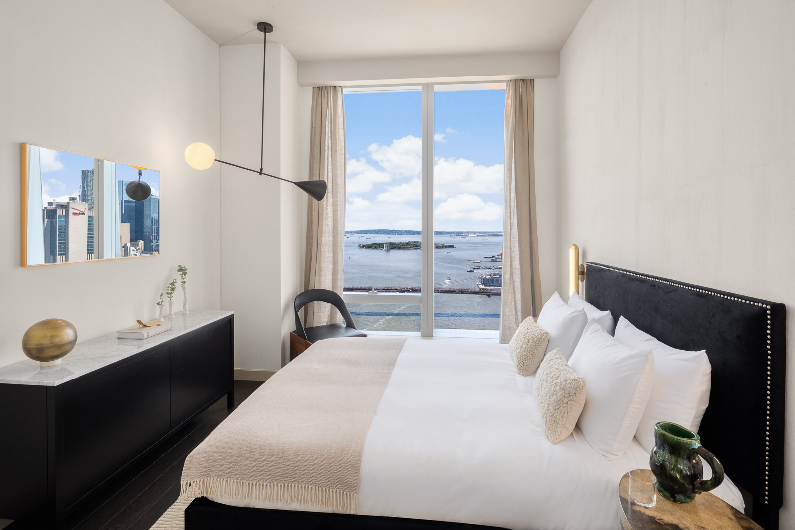 252 South Street, Unit 77B Manhattan, NY 10002 - Photo 9 of 43 a bedroom with a bed and a window