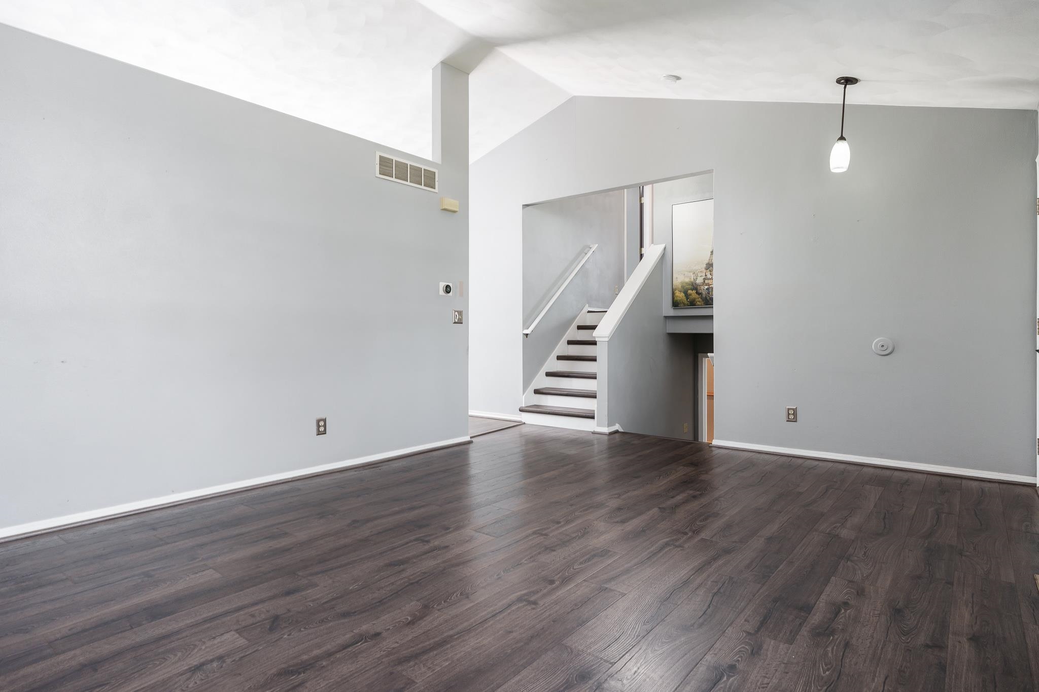 1996 Broadmoor Road Rockton, IL 61072 - Photo 16 of 45 a view of an empty room with wooden floor and stairs