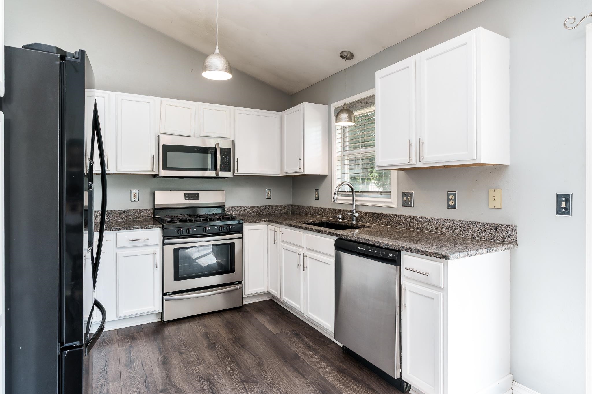 1996 Broadmoor Road Rockton, IL 61072 - Photo 21 of 45 a kitchen with stainless steel appliances granite countertop a stove a sink and a refrigerator