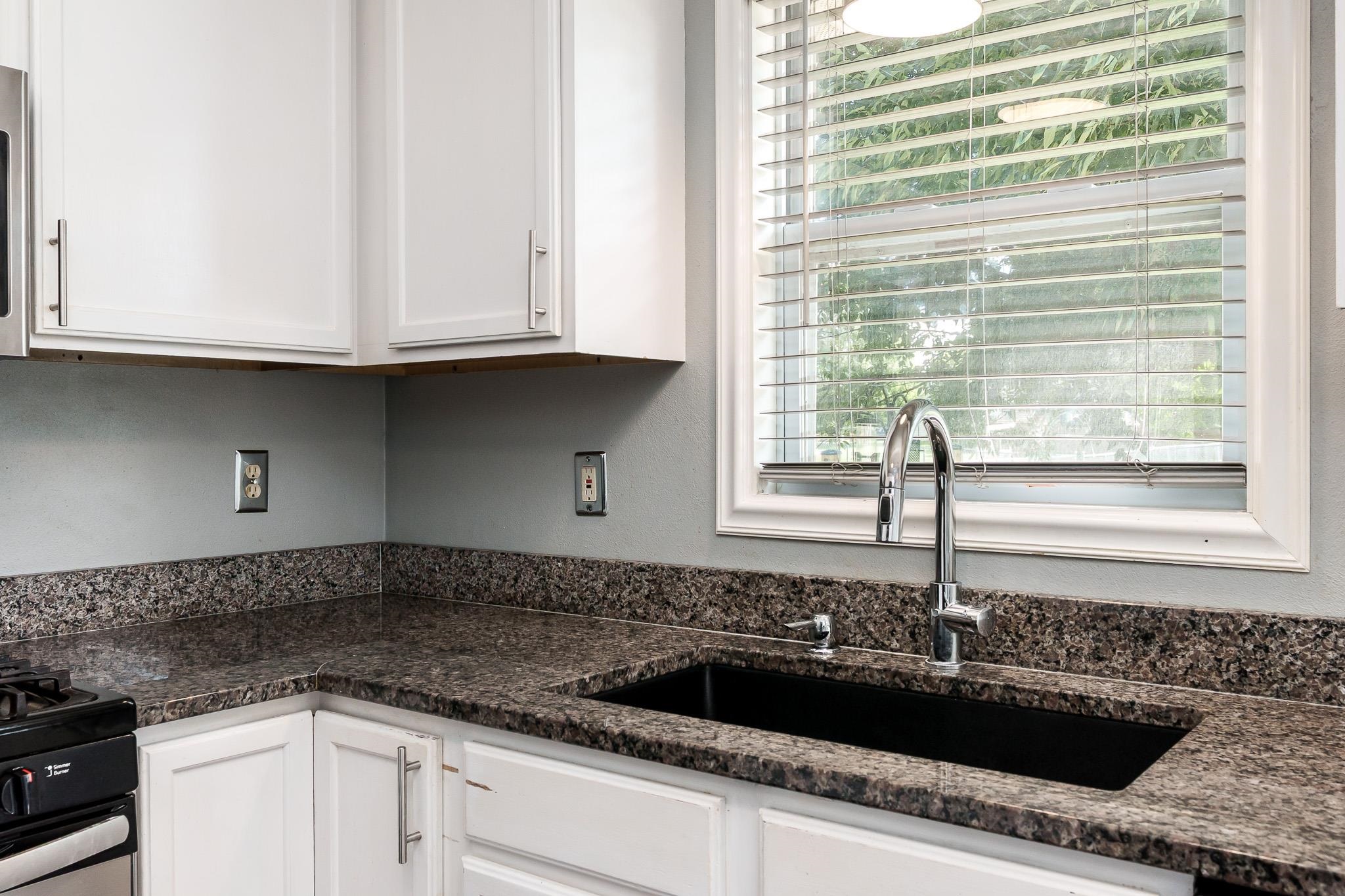 1996 Broadmoor Road Rockton, IL 61072 - Photo 22 of 45 a kitchen with granite countertop a sink and a window
