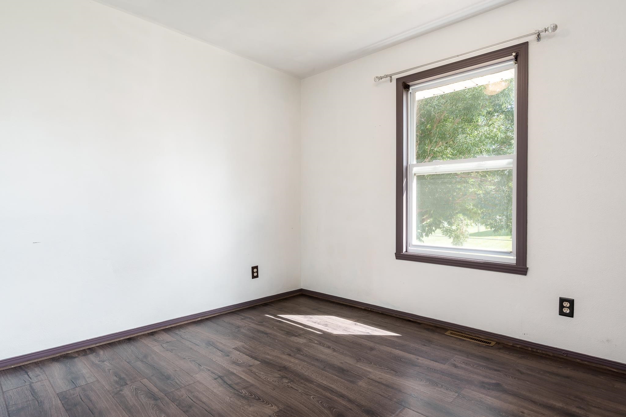 1996 Broadmoor Road Rockton, IL 61072 - Photo 30 of 45 an empty room with wooden floor and windows