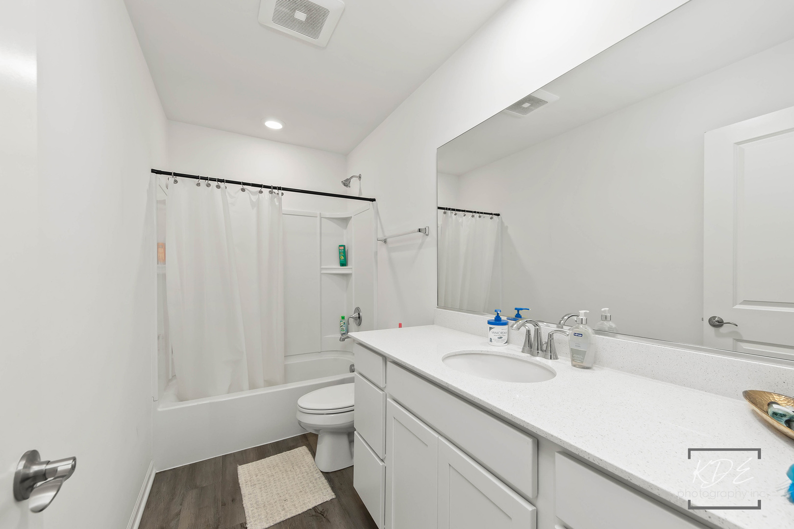 1663 Sager Way Batavia, IL 60510 - Photo 18 of 22 a bathroom with a sink toilet a mirror and shower