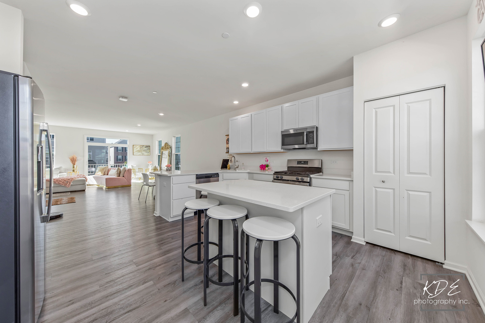 1663 Sager Way Batavia, IL 60510 - Photo 4 of 22 a open kitchen with white cabinets and stainless steel appliances