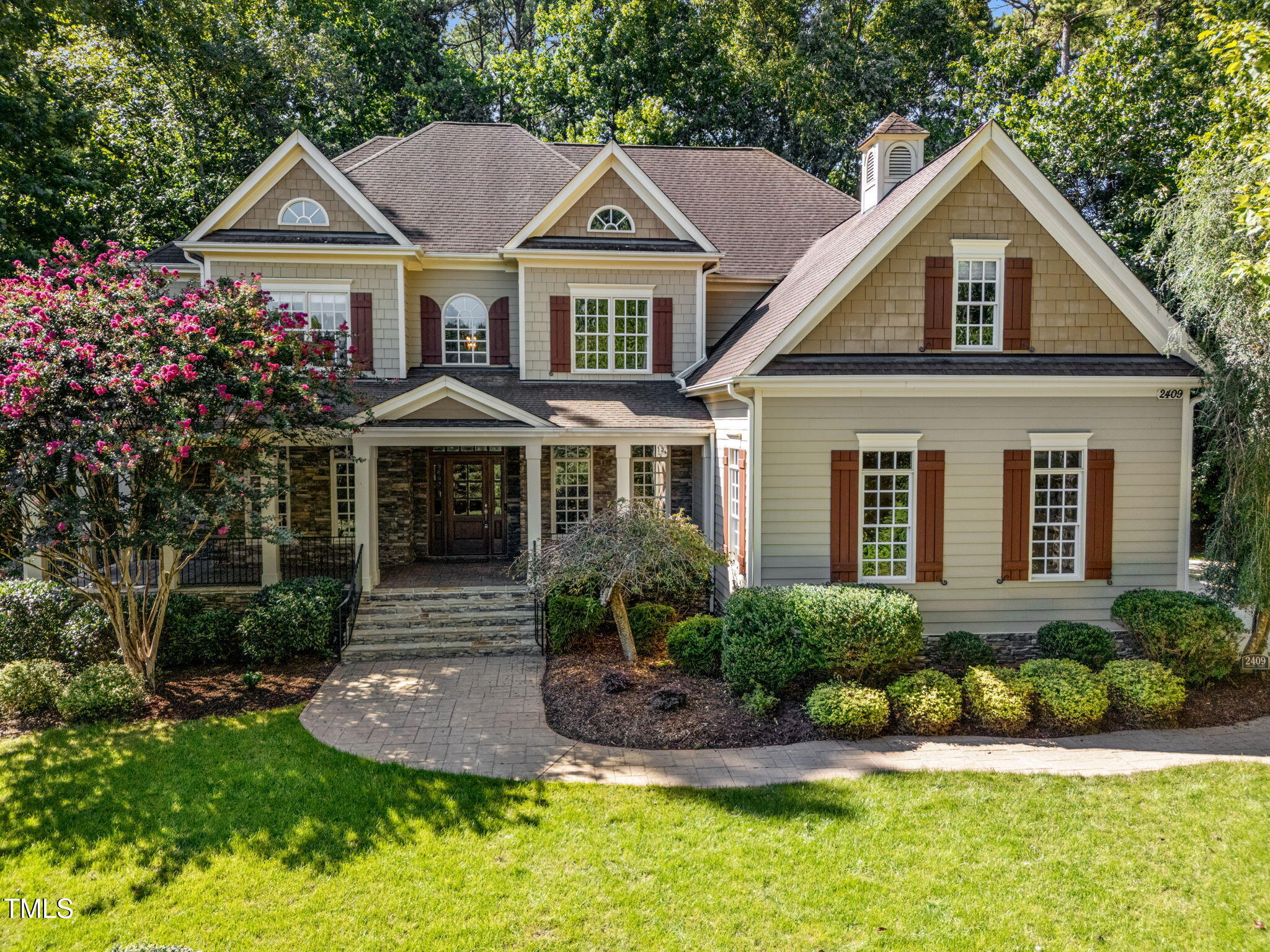 2409 Loring Court Raleigh, NC 27613 - Photo 1 of 60 a front view of a house with a yard and potted plants