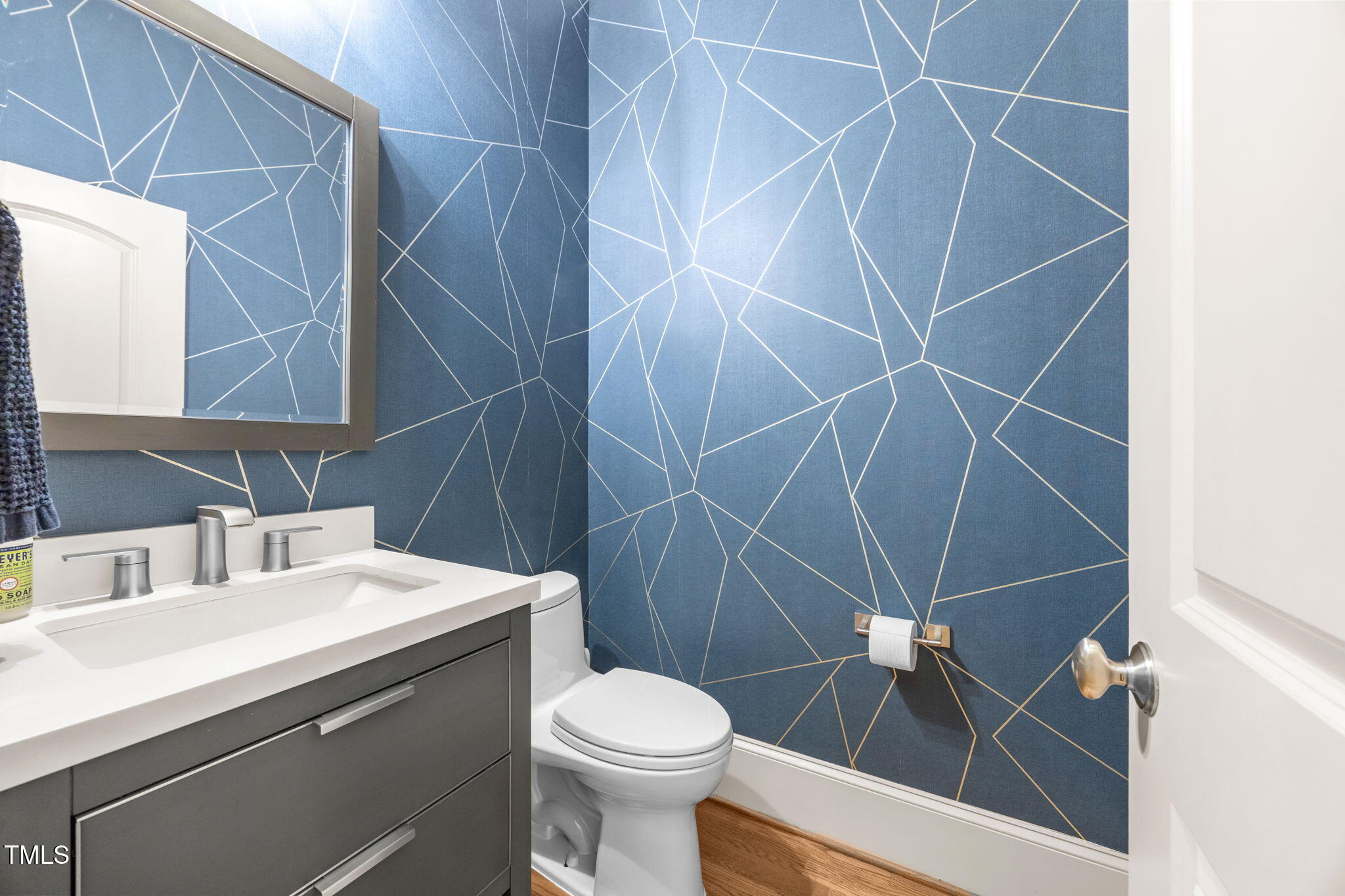 2409 Loring Court Raleigh, NC 27613 - Photo 15 of 60 a bathroom with a sink toilet and shower