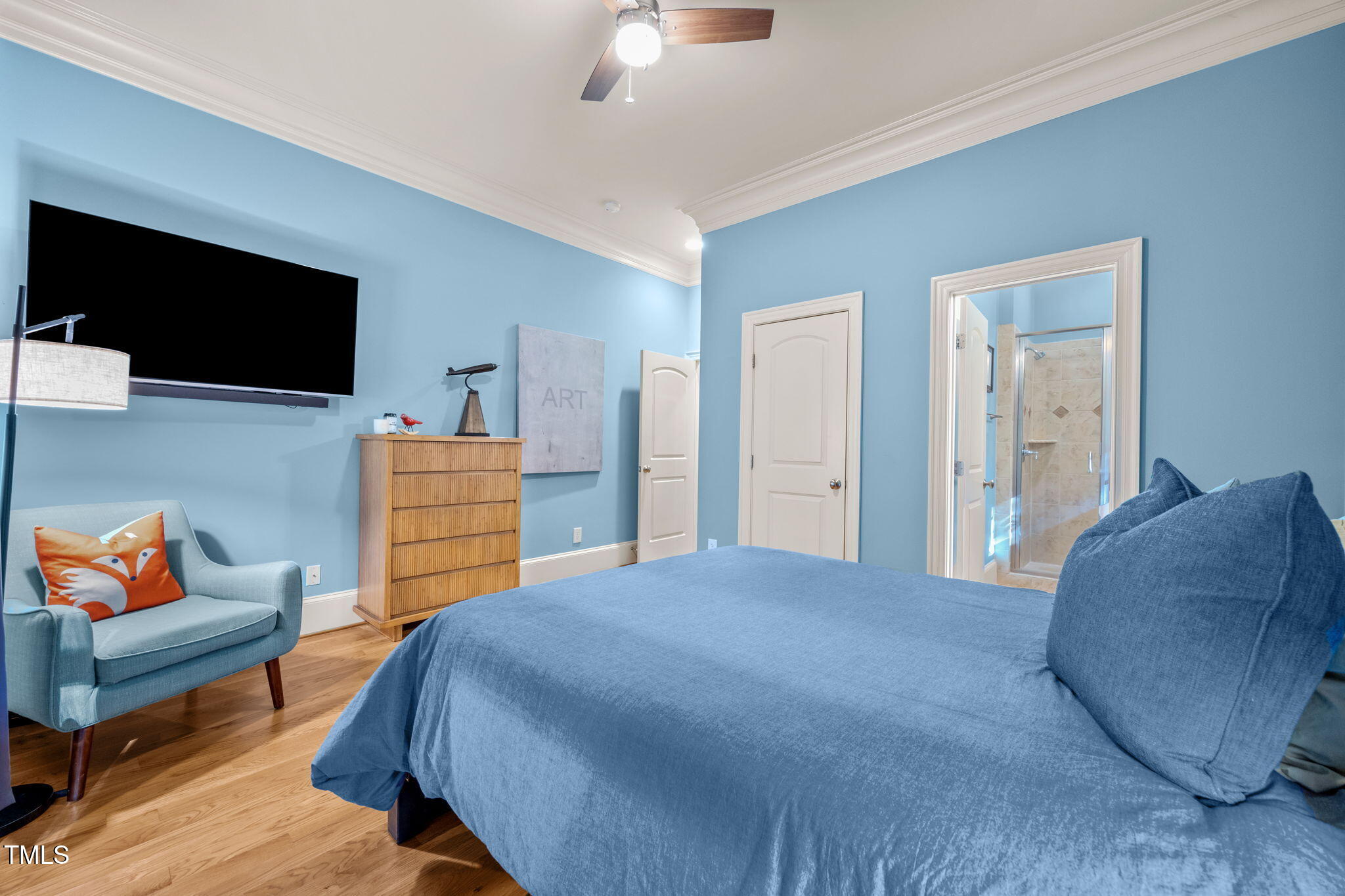2409 Loring Court Raleigh, NC 27613 - Photo 17 of 60 a bedroom with a bed and a television