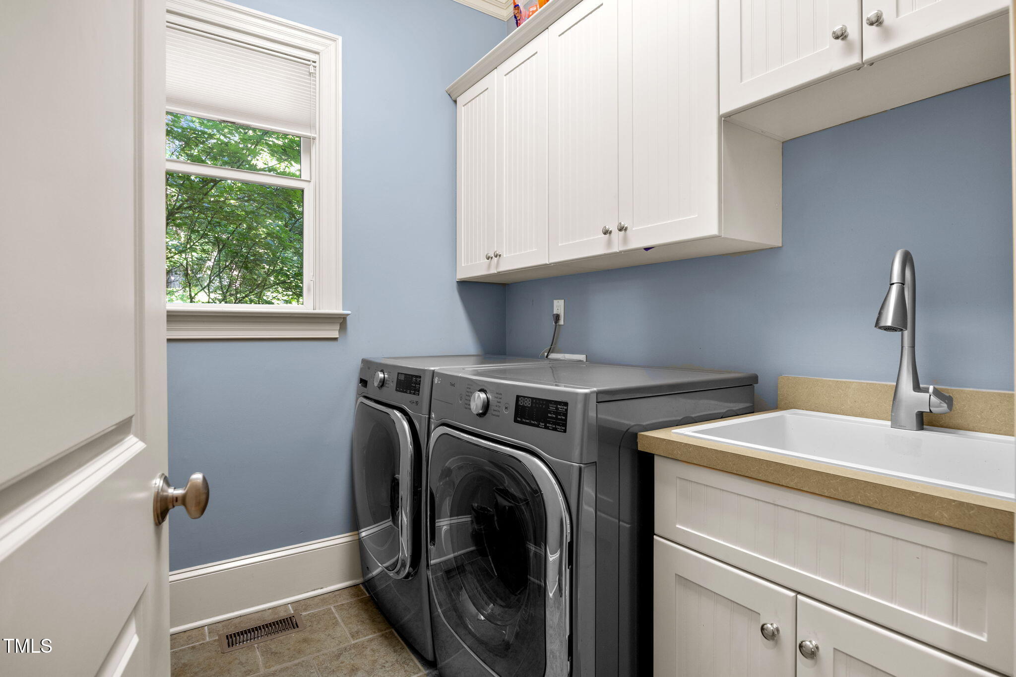 2409 Loring Court Raleigh, NC 27613 - Photo 19 of 60 a utility room with dryer and washer