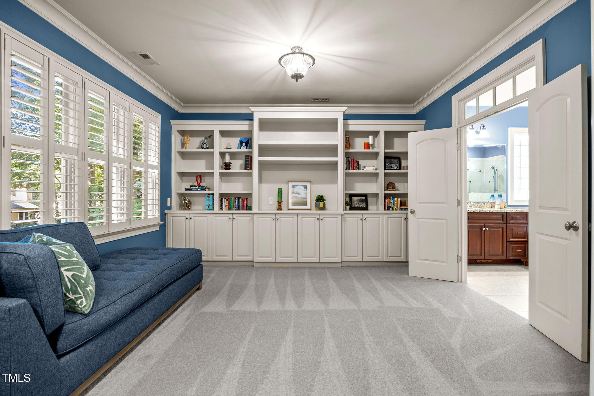 2409 Loring Court Raleigh, NC 27613 - Photo 23 of 60 a living room with furniture and a large window