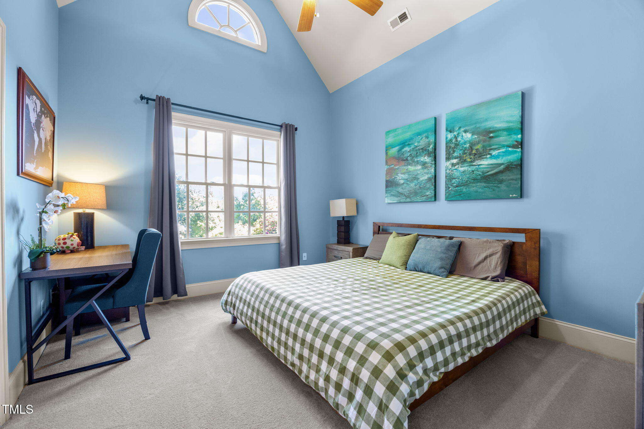 2409 Loring Court Raleigh, NC 27613 - Photo 29 of 60 a bedroom with a bed a large window and a desk