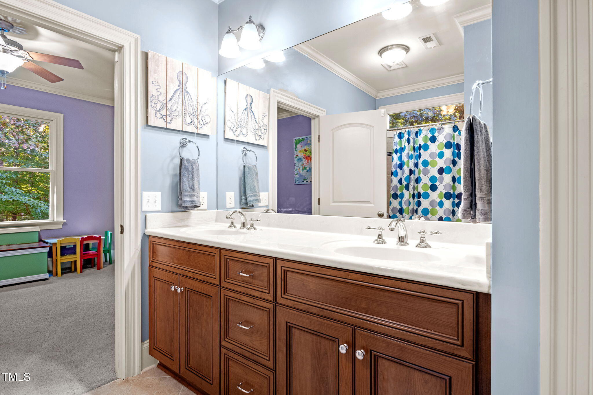 2409 Loring Court Raleigh, NC 27613 - Photo 37 of 60 a bathroom with a sink double vanity and a mirror