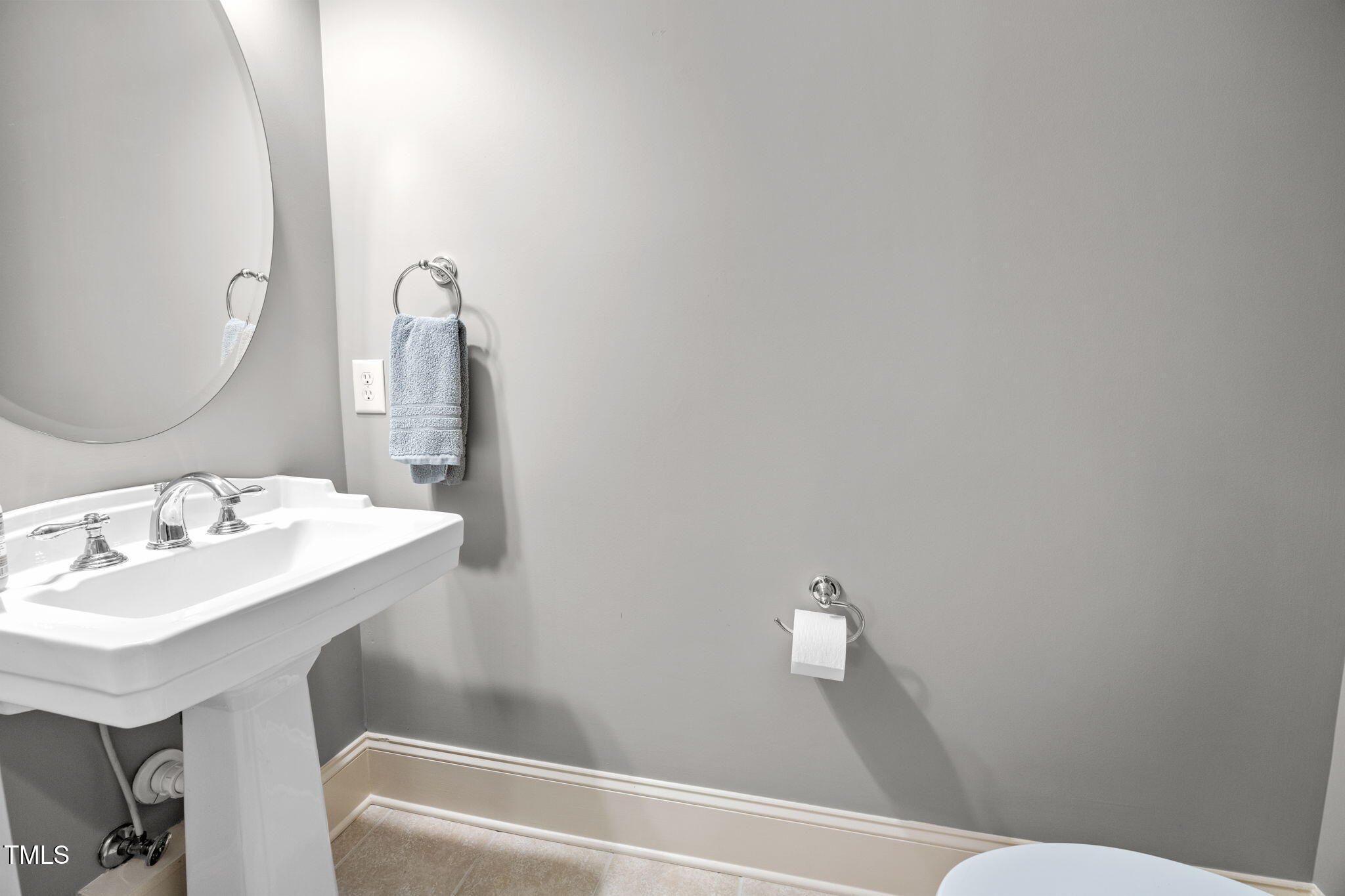 2409 Loring Court Raleigh, NC 27613 - Photo 41 of 60 a bathroom with a sink and a mirror