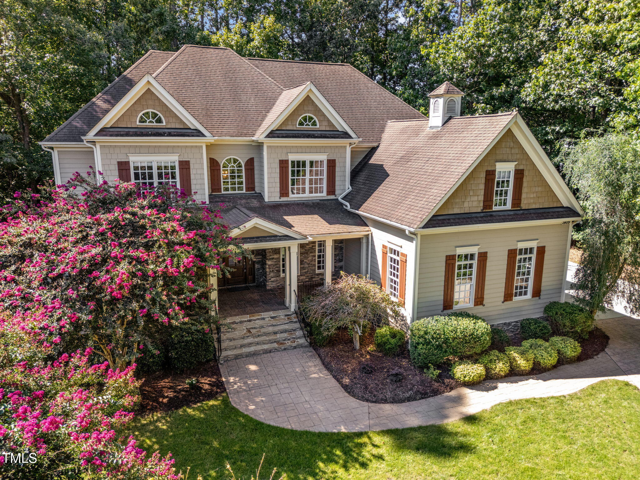 2409 Loring Court Raleigh, NC 27613 - Photo 53 of 60 a front view of a house with a yard and potted plants