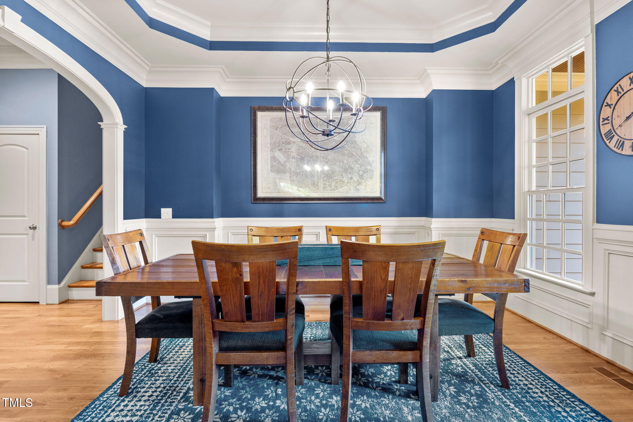 2409 Loring Court Raleigh, NC 27613 - Photo 6 of 60 a view of a dining room with furniture wooden floor and a chandelier