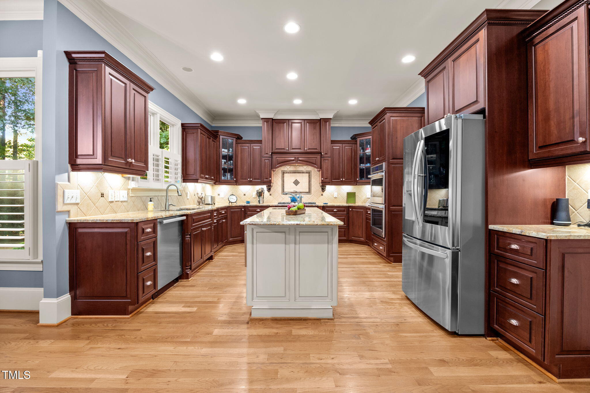 2409 Loring Court Raleigh, NC 27613 - Photo 7 of 60 a kitchen with stainless steel appliances granite countertop a refrigerator stove and oven