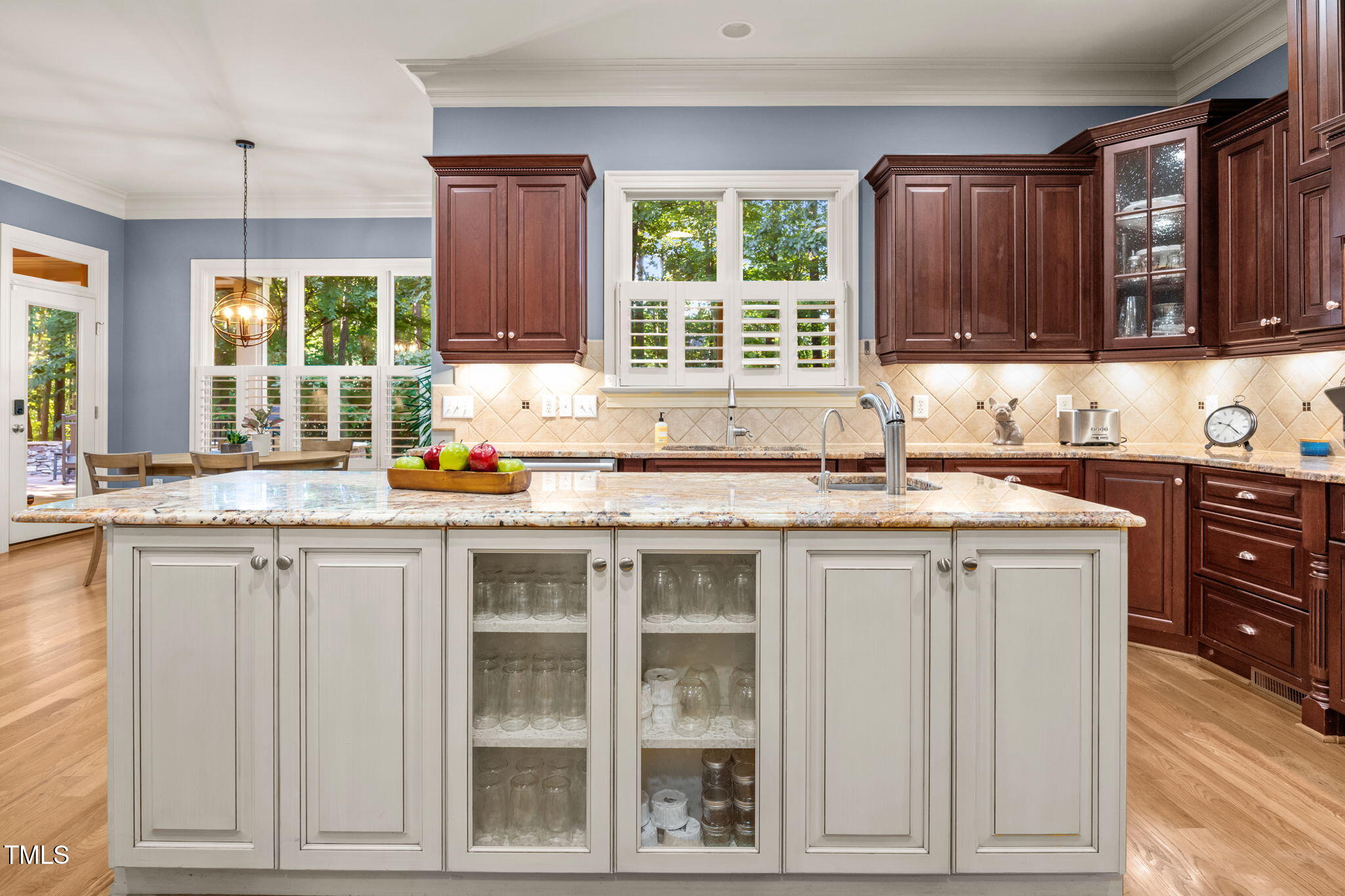 2409 Loring Court Raleigh, NC 27613 - Photo 10 of 60 a kitchen with granite countertop a sink window and cabinets