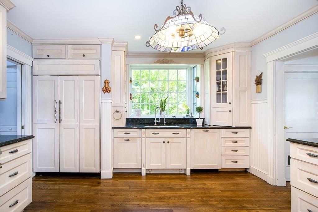 185 Downer Avenue Hingham, MA 02043 - Photo 21 of 30 a kitchen with stainless steel appliances a white table chairs and window