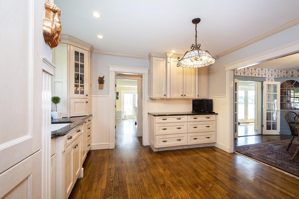 185 Downer Avenue Hingham, MA 02043 - Photo 23 of 30 a kitchen with stainless steel appliances a stove refrigerator and chandelier