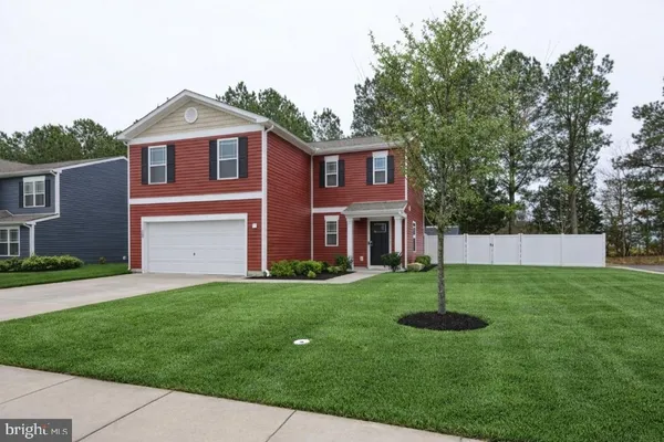 a view of brick building with plants