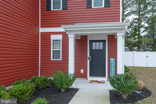 a view of brick building with plants