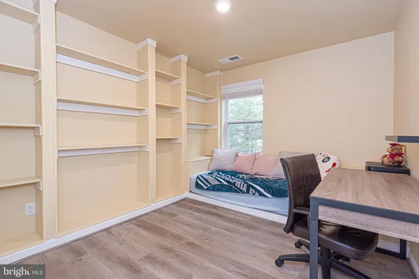 a bathroom with a sink a mirror and shower