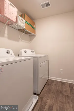 a view of a patio with a table and chairs