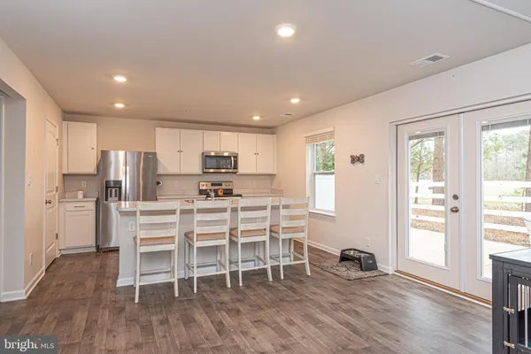 a kitchen with a table and chairs in it