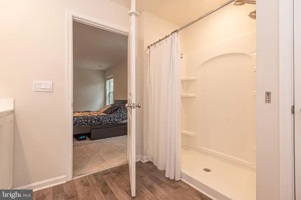 a en suite bathroom with a sink and a mirror
