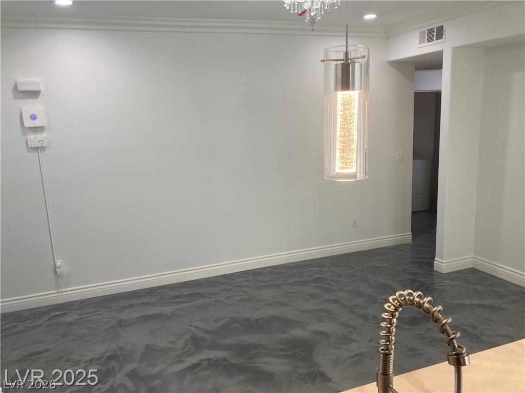 9050 West Warm Springs Road, Unit 1027 Las Vegas, NV 89148 - Photo 12 of 44 Artfully designed lighting illuminates the distinctively textured flooring throughout this modern interior space.