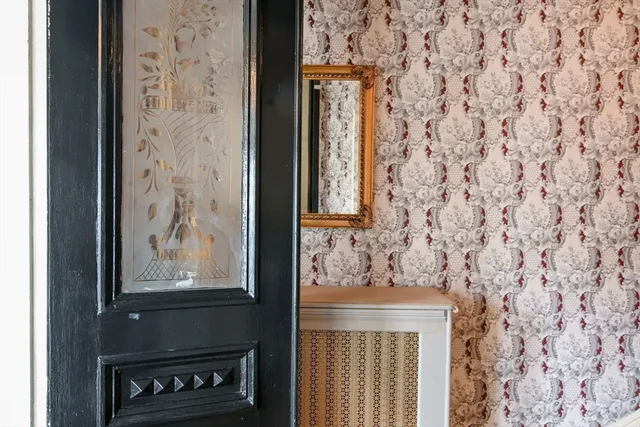 a view of a kitchen with stainless steel appliances granite countertop a refrigerator and a window