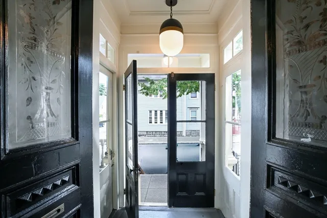 a view of entryway with wooden floor