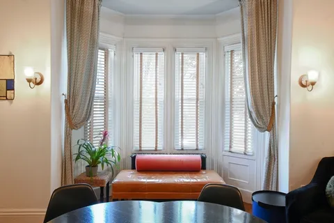 a view of a dining room with furniture window and outside view
